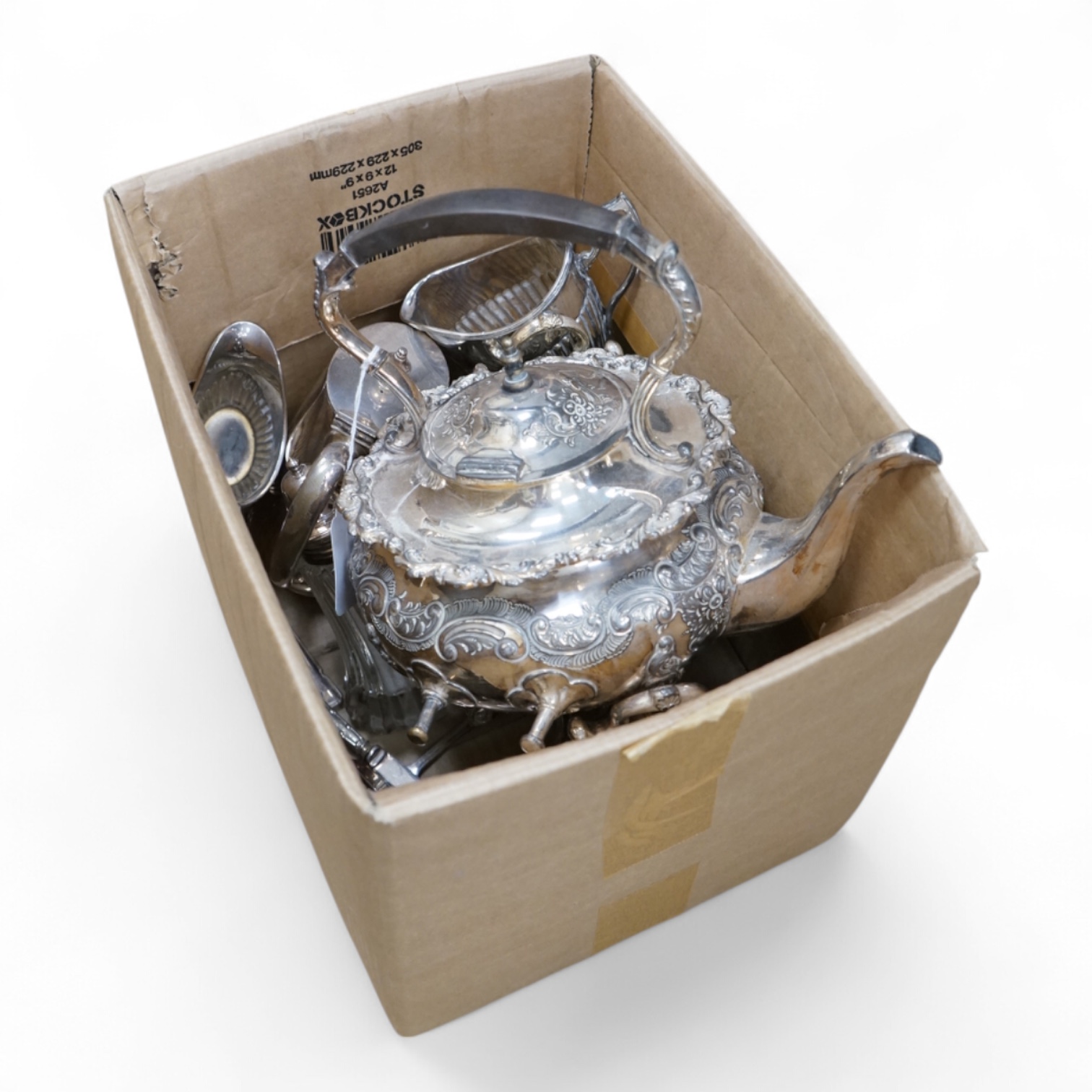 A plated tea kettle and other assorted plated ware.